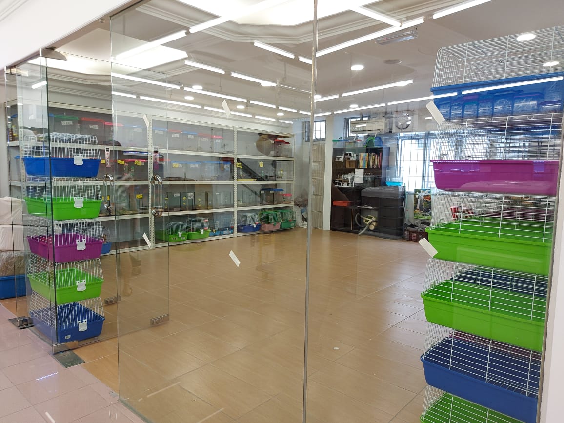 Small animal cages and habitats on display in store