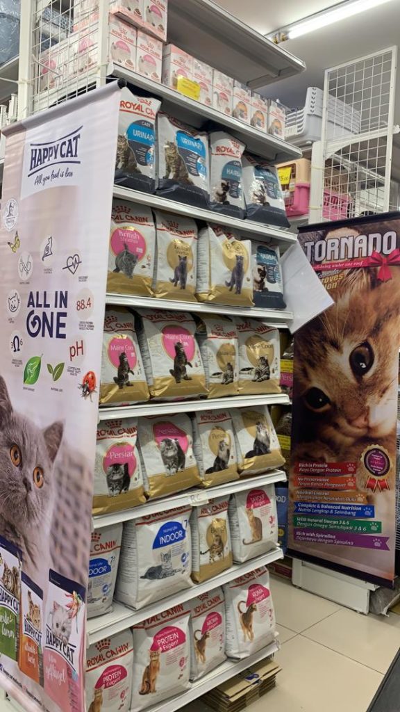 Shelves stocked with cat food brands
